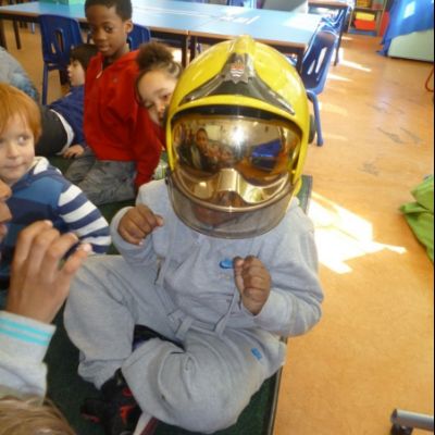 Trying on the fireman's helmet in Class 1_2R